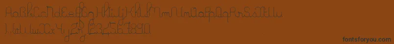 fuente ALaNagePers2011 – Fuentes Negras Sobre Fondo Marrón
