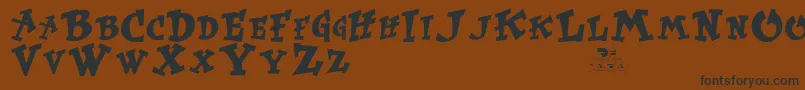 Krtrussell Font – Black Fonts on Brown Background