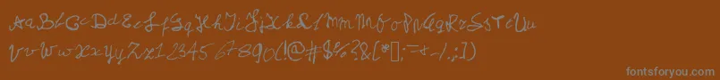 Czcionka Myschoolhandwriting – szare czcionki na brązowym tle