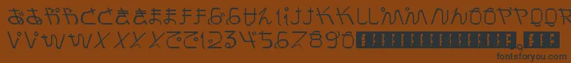 フォントPrayForJapan – 黒い文字が茶色の背景にあります