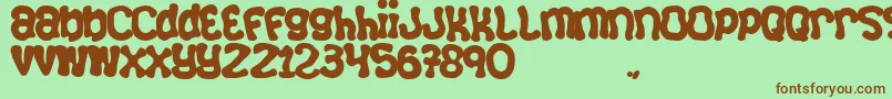 Squizzli Font – Brown Fonts on Green Background