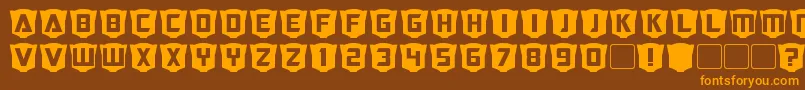 RubcapsCybertron-fontti – oranssit fontit ruskealla taustalla