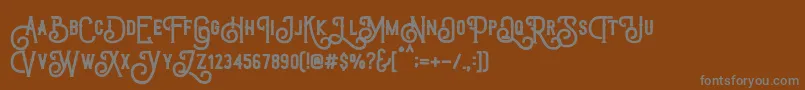 Шрифт TriumphWheelsRough – серые шрифты на коричневом фоне