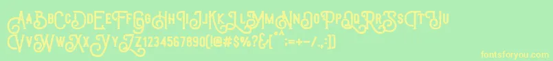 フォントTriumphWheelsRough – 黄色の文字が緑の背景にあります