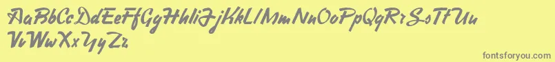 Fonte HeavySquaredWriting – fontes cinzas em um fundo amarelo