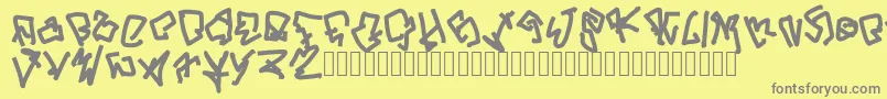 ButYouCanGetFucked-fontti – harmaat kirjasimet keltaisella taustalla