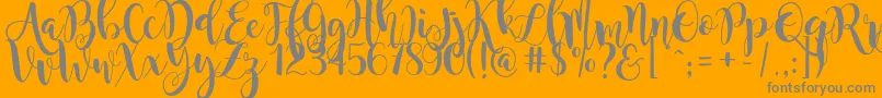 MagnoliaSky-Schriftart – Graue Schriften auf orangefarbenem Hintergrund