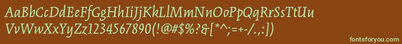 フォントKinesisstdItalic – 緑色の文字が茶色の背景にあります。