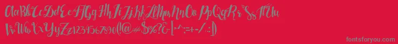 フォントLasermetal – 赤い背景に灰色の文字