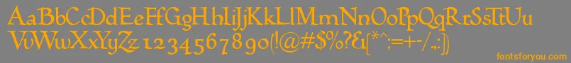 フォントHumana – オレンジの文字は灰色の背景にあります。