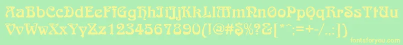 QtarniebRegular Font – Yellow Fonts on Green Background