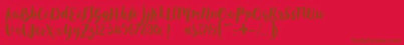 AngelineVintageDemo-Schriftart – Braune Schriften auf rotem Hintergrund