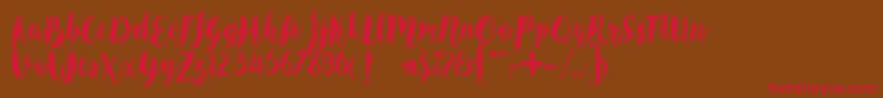 フォントAngelineVintageDemo – 赤い文字が茶色の背景にあります。