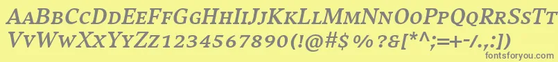 フォントCompatilExquisitLtComBoldItalicSmallCaps – 黄色の背景に灰色の文字