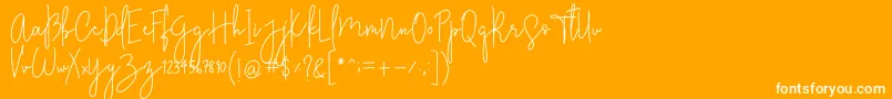 StylishcharmFree-fontti – valkoiset fontit oranssilla taustalla