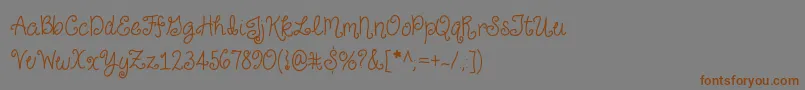 Шрифт JustForGiggles – коричневые шрифты на сером фоне