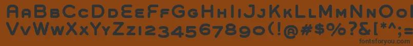 GroverCapsBold-fontti – mustat fontit ruskealla taustalla