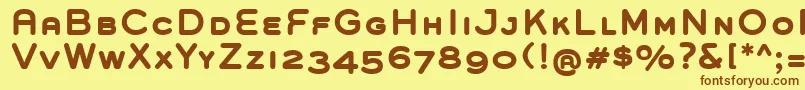 フォントGroverCapsBold – 茶色の文字が黄色の背景にあります。