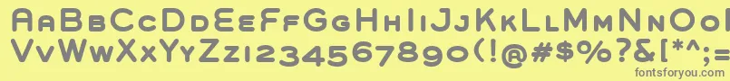 フォントGroverCapsBold – 黄色の背景に灰色の文字