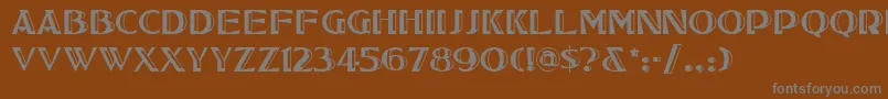 フォントTucsonone – 茶色の背景に灰色の文字