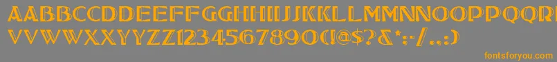 フォントTucsonone – オレンジの文字は灰色の背景にあります。