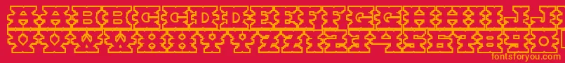 フォントMontezuma – 赤い背景にオレンジの文字