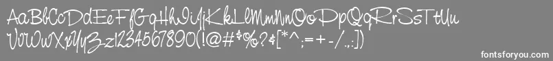 フォントStCursiveHand – 灰色の背景に白い文字