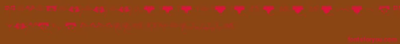 Fonte JugendstilFlowersFree – fontes vermelhas em um fundo marrom