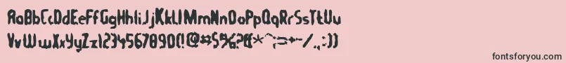 フォントTommygun – ピンクの背景に黒い文字