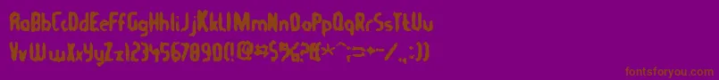 Tommygun-fontti – ruskeat fontit violetilla taustalla