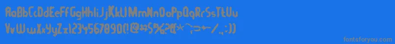 Tommygun Font – Gray Fonts on Blue Background