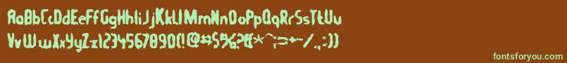 フォントTommygun – 緑色の文字が茶色の背景にあります。