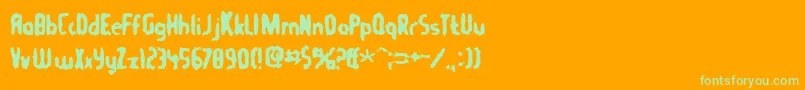 Tommygun Font – Green Fonts on Orange Background