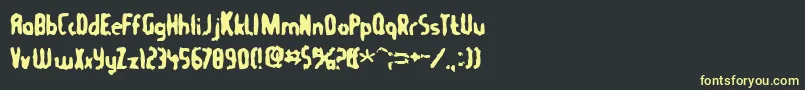 Tommygun Font – Yellow Fonts on Black Background