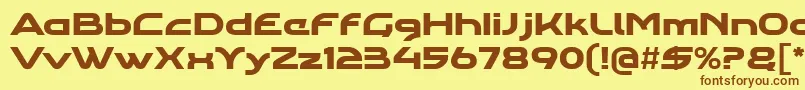 フォントAgharawideregular – 茶色の文字が黄色の背景にあります。