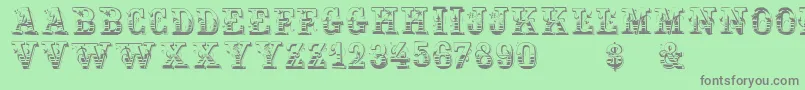 フォントHoltzschue – 緑の背景に灰色の文字