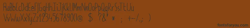 DkPimpernel Font – Black Fonts on Brown Background
