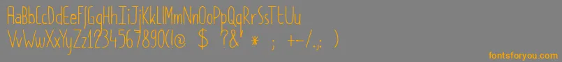 フォントDkPimpernel – オレンジの文字は灰色の背景にあります。