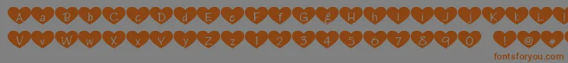 Heartattack-Schriftart – Braune Schriften auf grauem Hintergrund