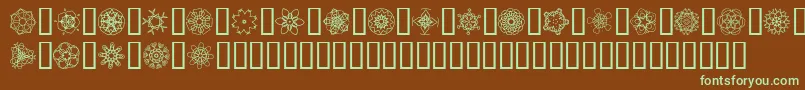 フォントJiKaleidoscopeBats4 – 緑色の文字が茶色の背景にあります。