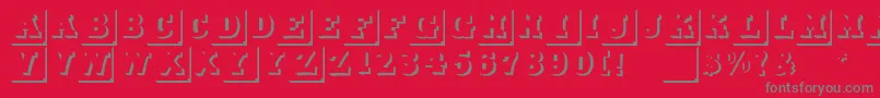 フォントDuodezinitialen – 赤い背景に灰色の文字
