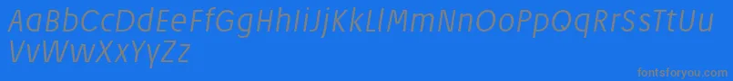 JosefReducedLightitalic-fontti – harmaat kirjasimet sinisellä taustalla