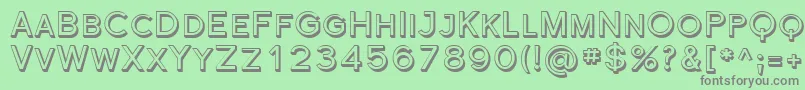 FlorencesansScShaded-fontti – harmaat kirjasimet vihreällä taustalla