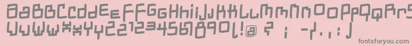フォントDadastracesfreeshapesBolditalic – ピンクの背景に灰色の文字