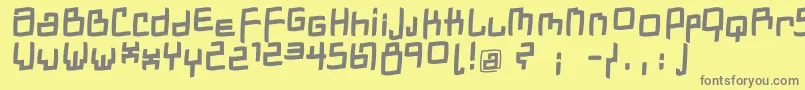 DadastracesfreeshapesBolditalic-Schriftart – Graue Schriften auf gelbem Hintergrund