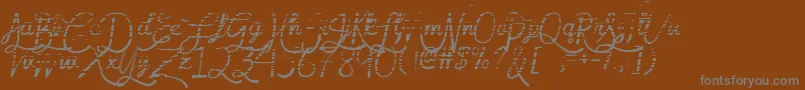 フォントMfGradientGoddess – 茶色の背景に灰色の文字