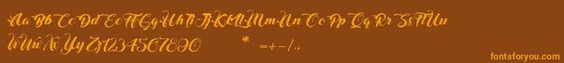 ChristmasInFinland Font – Orange Fonts on Brown Background