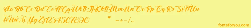 フォントChristmasInFinland – オレンジの文字が黄色の背景にあります。