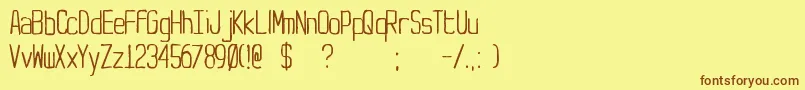 Yt-Schriftart – Braune Schriften auf gelbem Hintergrund