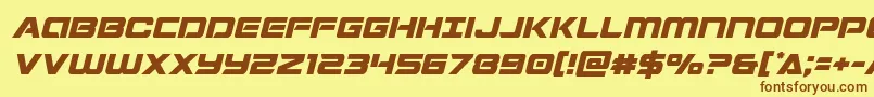 フォントStardustersemital – 茶色の文字が黄色の背景にあります。